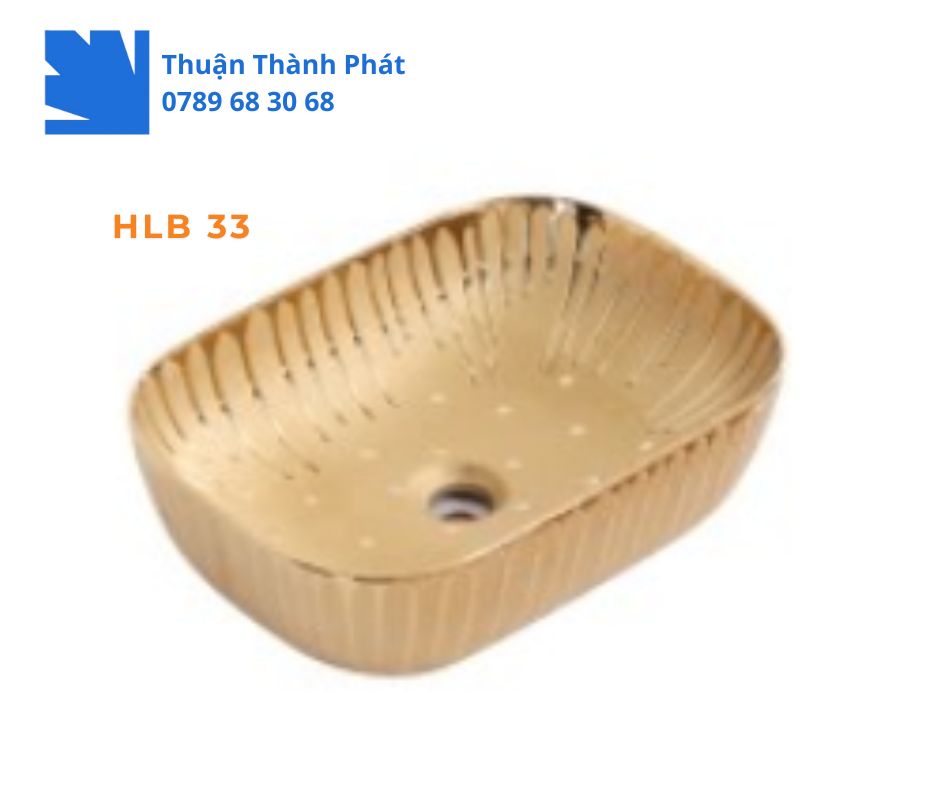 Lavabo đặt bàn Haphako HLB 33 màu vàng óng ánh, hình chữ nhật bo tròn với họa tiết gân nổi.